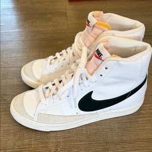 Nike White High-Top Sneakers with Black Swoosh